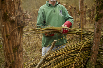 Malcolm volunteering on a reserve