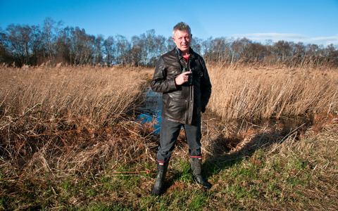 Stephen standing in front of wetland