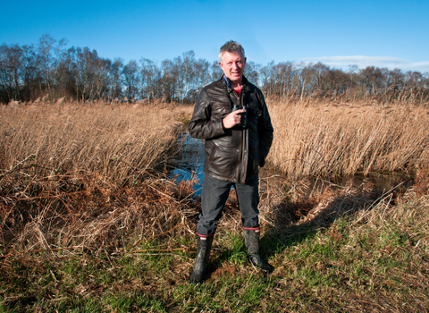 Stephen standing in front of wetland